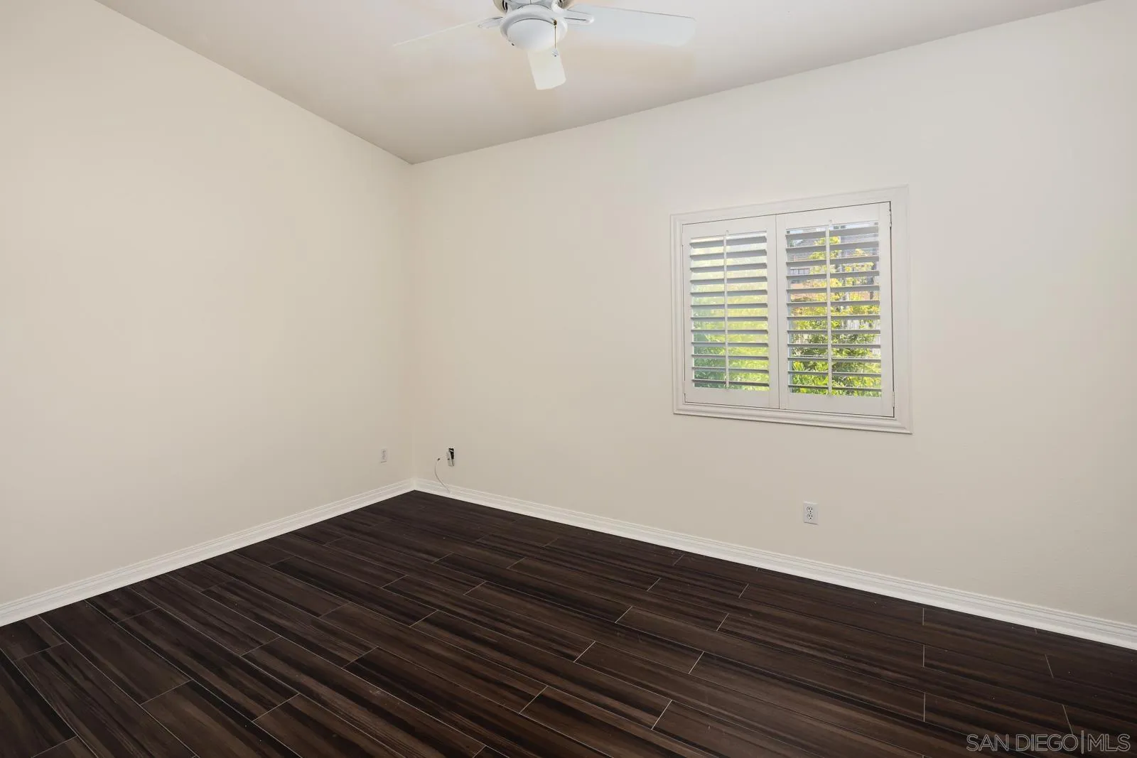 828 D Coronado, CA 92118 - Photo 21 of 24 an empty room with wooden floor and windows