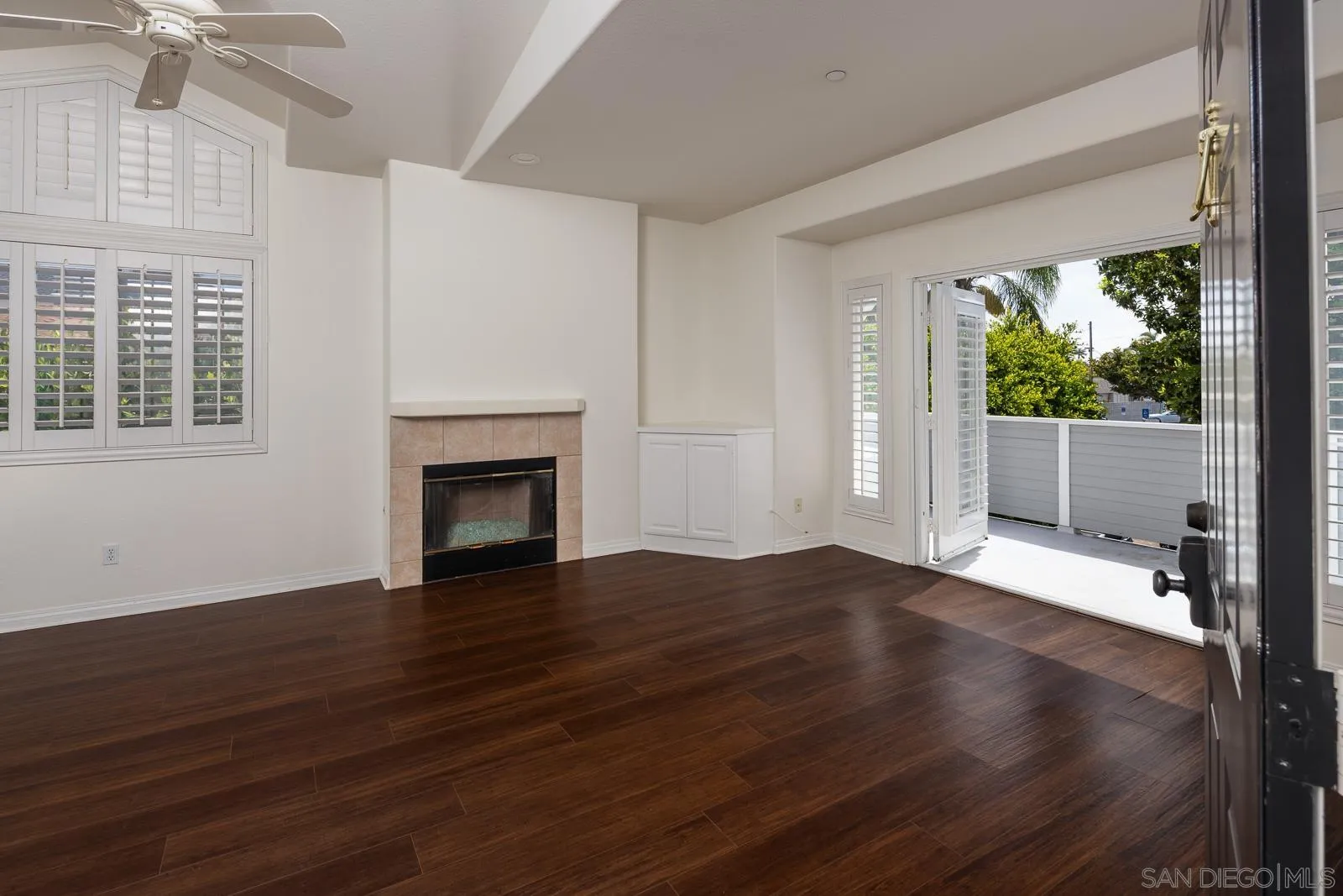 828 D Coronado, CA 92118 - Photo 4 of 24 a view of an empty room with wooden floor and a window