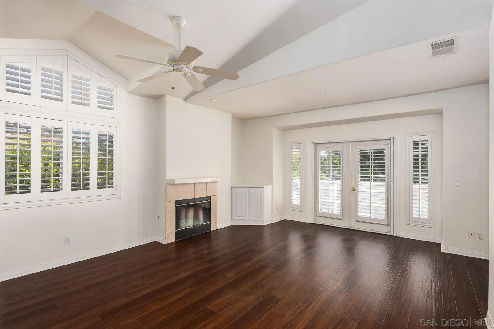 828 D Coronado, CA 92118 - Photo 9 of 24 a view of an empty room with wooden floor and a window