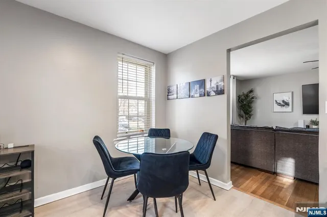 a dining room with furniture and window