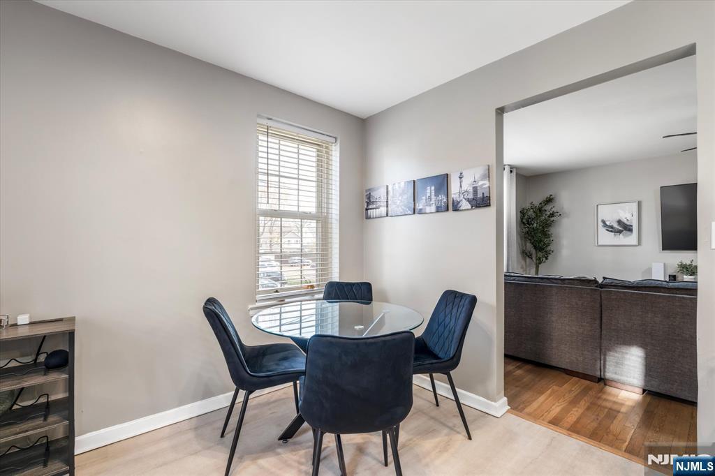 126 Hackett Place, Unit 101A Rutherford, NJ 07070 - Photo 14 of 22 a dining room with furniture and window