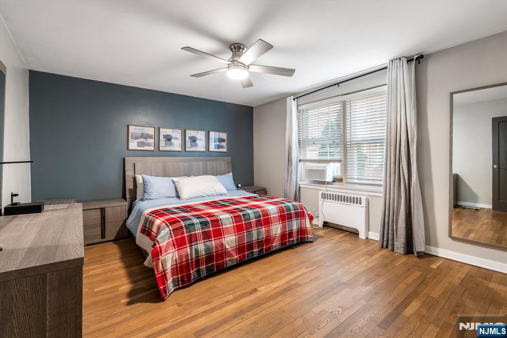 126 Hackett Place, Unit 101A Rutherford, NJ 07070 - Photo 16 of 22 a bedroom with a bed and a window