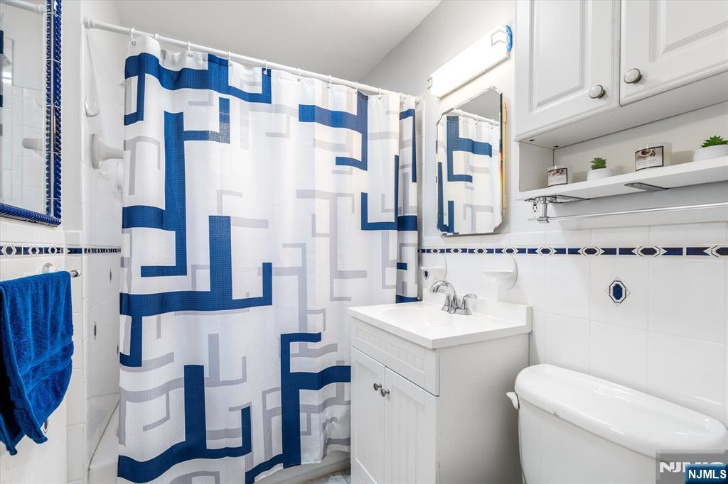 126 Hackett Place, Unit 101A Rutherford, NJ 07070 - Photo 22 of 22 a bathroom with a sink toilet and shower