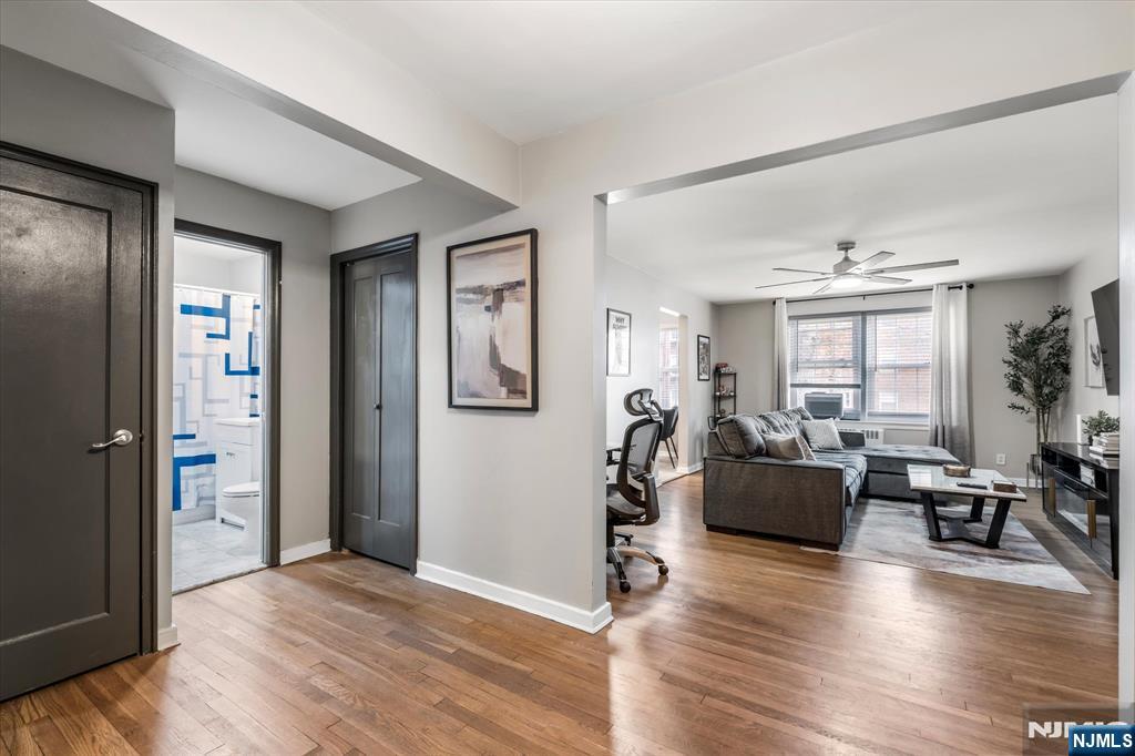 126 Hackett Place, Unit 101A Rutherford, NJ 07070 - Photo 5 of 22 a view of a livingroom with furniture window and wooden floor