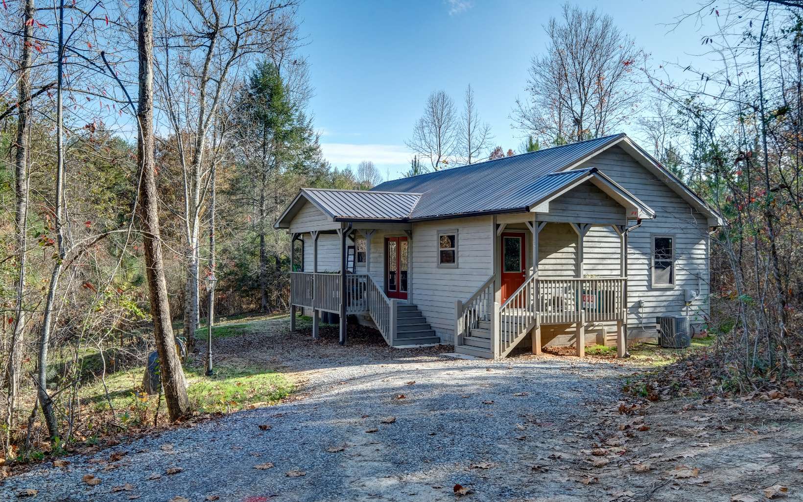 65 Rhubarb Lane Murphy, NC 28906 - Photo 1 of 1 a view of a house with a yard and large trees