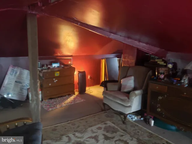 a living room with furniture and a lamp