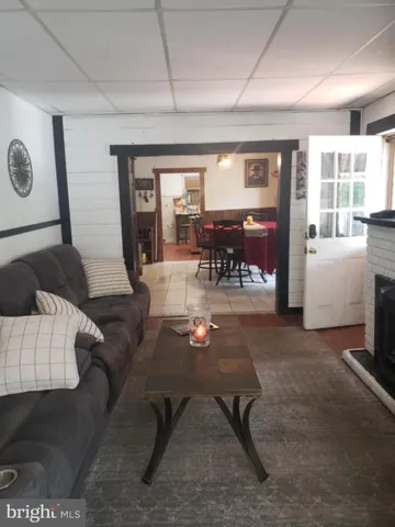 a living room with furniture and window