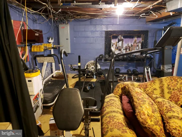 a view of a patio with table and chairs potted plants with wooden floor and fence