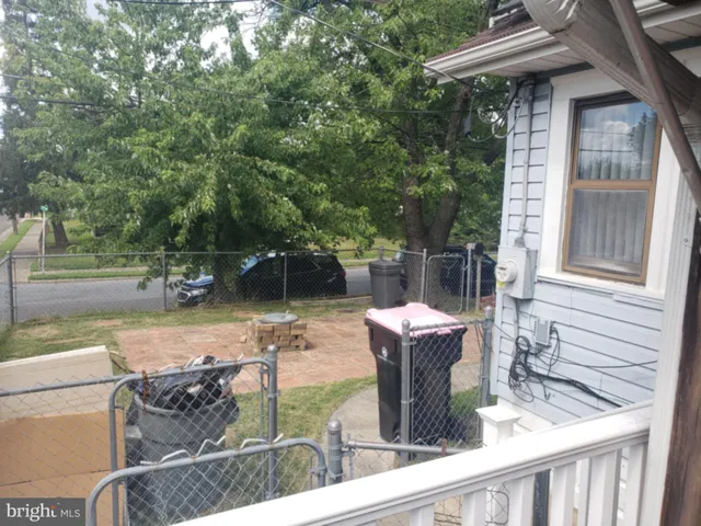 a view of a patio with wooden floor