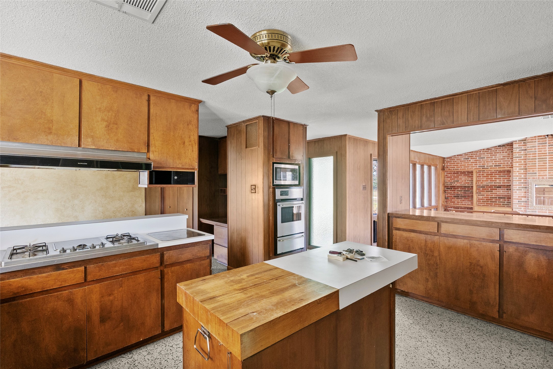 16121 Fm 2620 Road Bedias, TX 77831 - Photo 14 of 28 a kitchen with stainless steel appliances granite countertop a sink stove and refrigerator