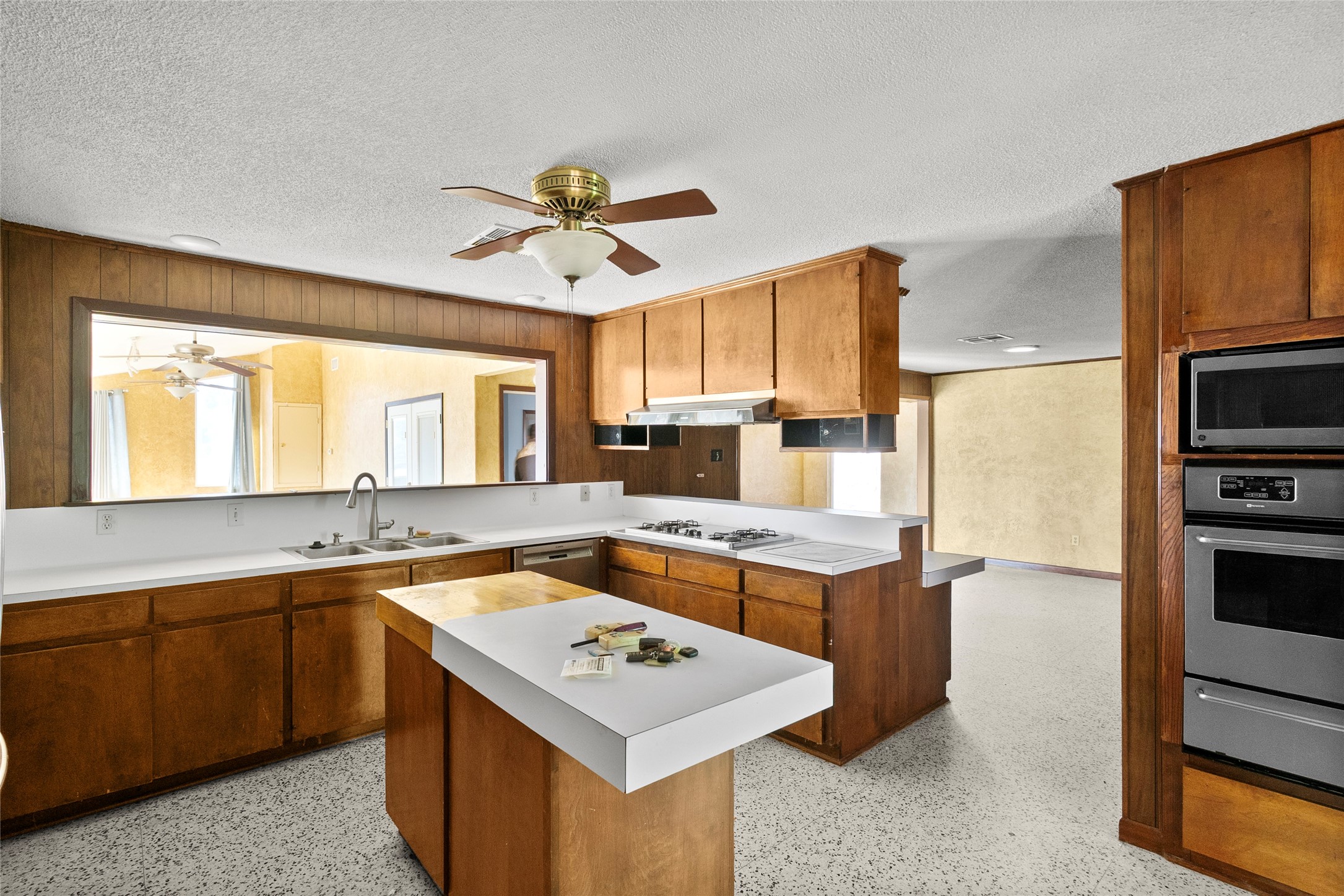 16121 Fm 2620 Road Bedias, TX 77831 - Photo 16 of 28 a kitchen with a stove a sink and a refrigerator