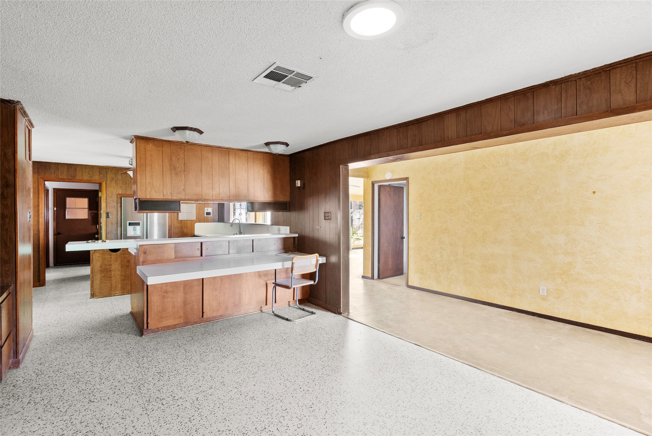 16121 Fm 2620 Road Bedias, TX 77831 - Photo 18 of 28 a living room with stainless steel appliances furniture a rug and a kitchen view
