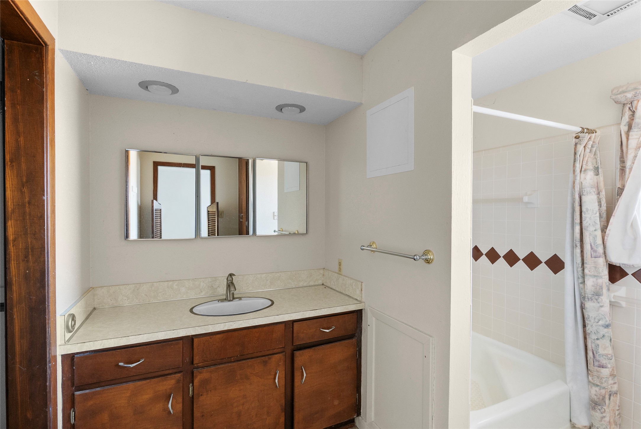 16121 Fm 2620 Road Bedias, TX 77831 - Photo 20 of 28 a bathroom with a sink a mirror and a shower