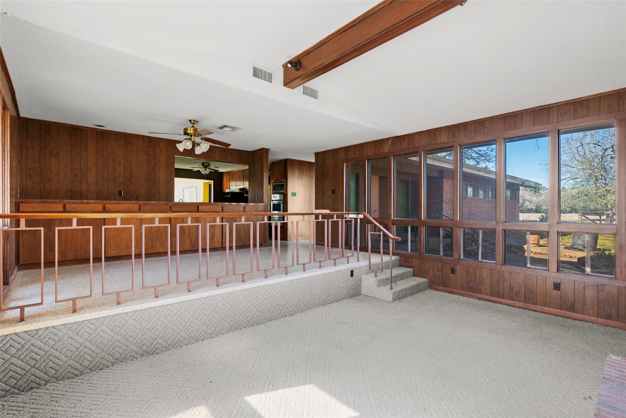 16121 Fm 2620 Road Bedias, TX 77831 - Photo 3 of 28 a view of a porch with furniture and floor to ceiling window