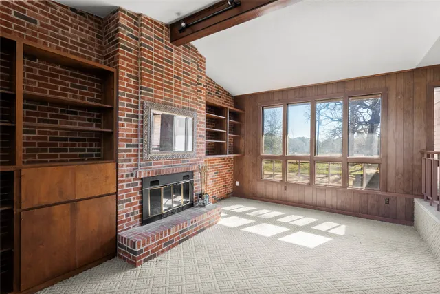 a view of livingroom with furniture and fireplace