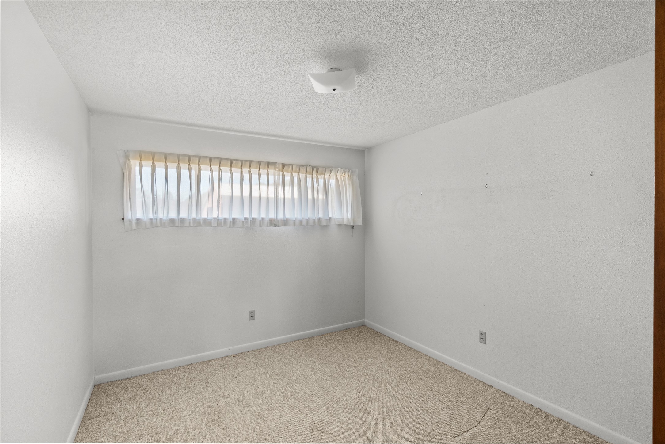 16121 Fm 2620 Road Bedias, TX 77831 - Photo 10 of 28 an empty room with a window