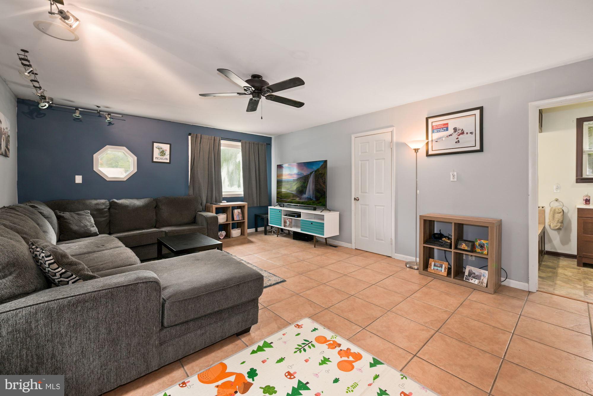 82 Richter Road Tabernacle, NJ 08088 - Photo 22 of 35 a living room with furniture and a flat screen tv