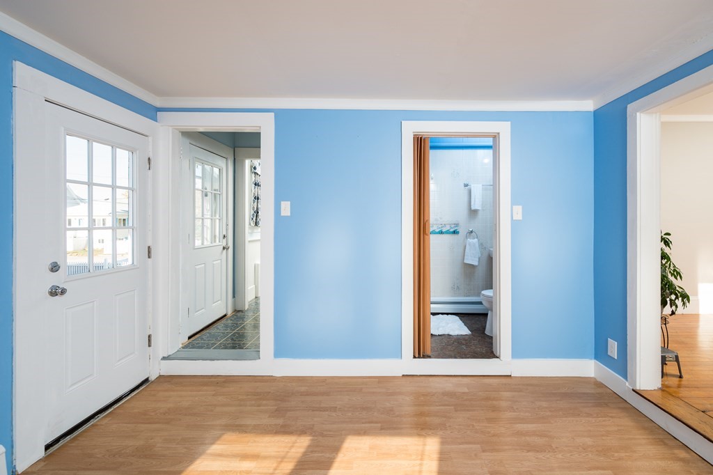 48 Bates Street Hull, MA 02045 - Photo 11 of 31 a view of a room with wooden floor and a window