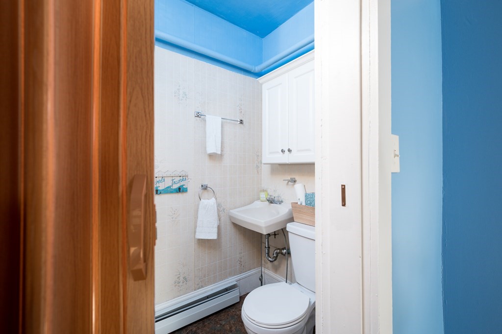 48 Bates Street Hull, MA 02045 - Photo 12 of 31 a bathroom with a sink toilet and shower