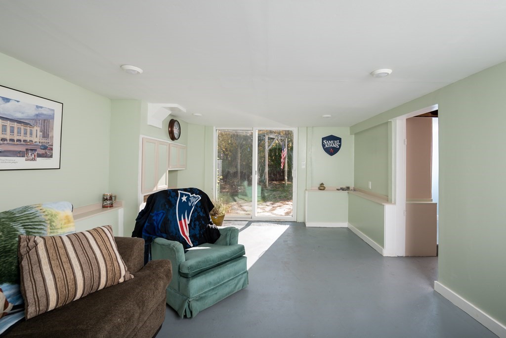 48 Bates Street Hull, MA 02045 - Photo 26 of 31 a living room with furniture and a large window