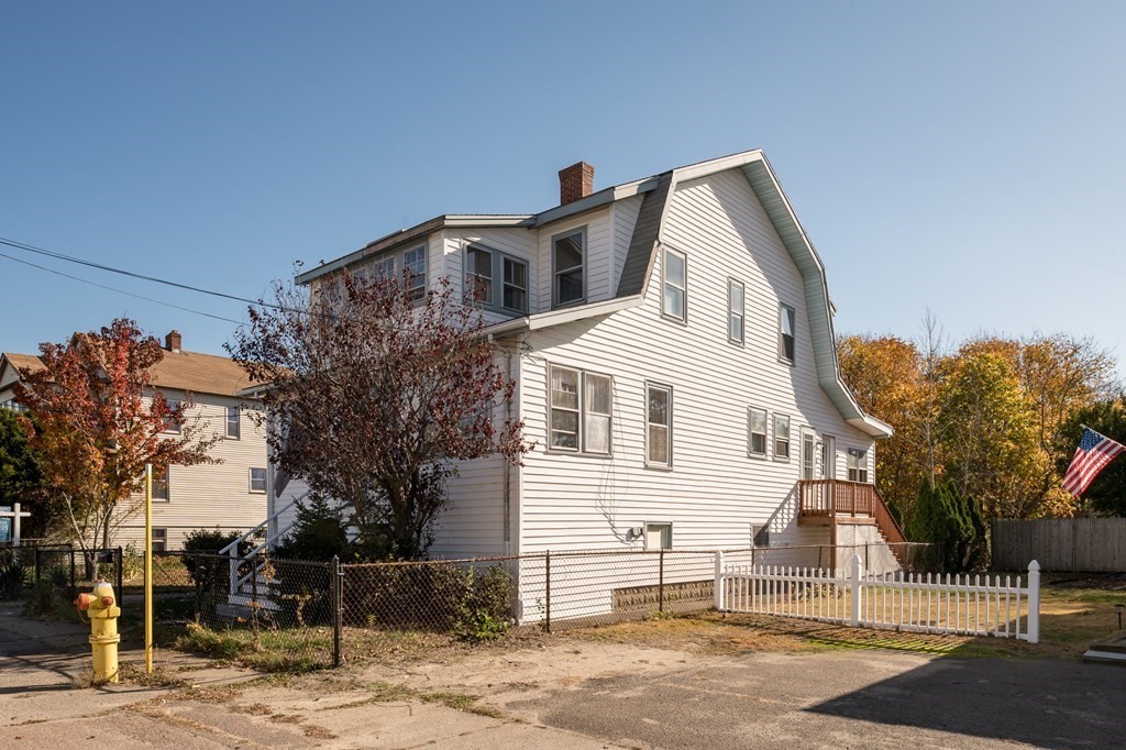 48 Bates Street Hull, MA 02045 - Photo 3 of 31 a front view of a house with a garage