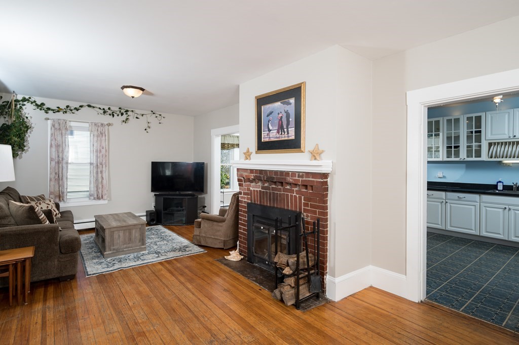 48 Bates Street Hull, MA 02045 - Photo 5 of 31 a living room with furniture and a fireplace
