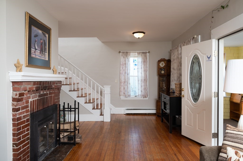 48 Bates Street Hull, MA 02045 - Photo 7 of 31 a view of entryway with livingroom and wooden floor
