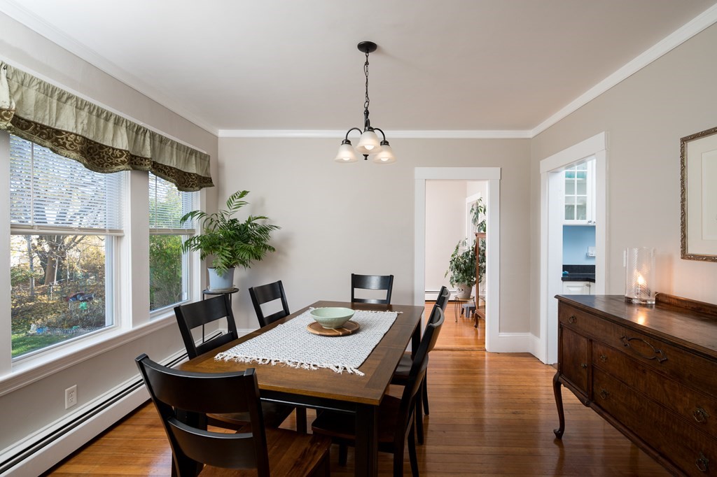 48 Bates Street Hull, MA 02045 - Photo 8 of 31 a dining room with furniture a chandelier and wooden floor