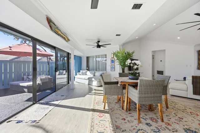 a kitchen with kitchen island stainless steel appliances a sink and cabinets