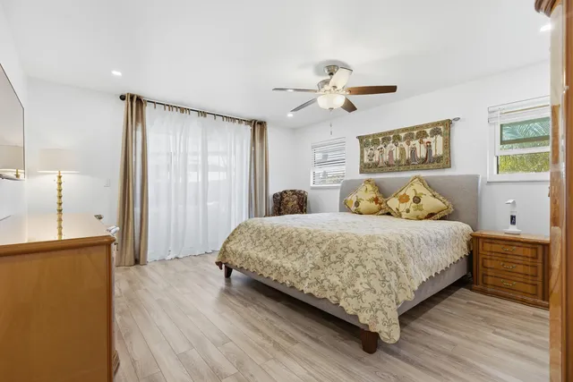 a bathroom with a sink mirror and vanity