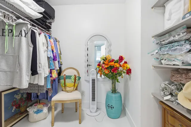 a front view of a house with a yard and fountain