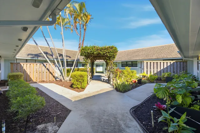 a view of swimming pool with a lounge chairs