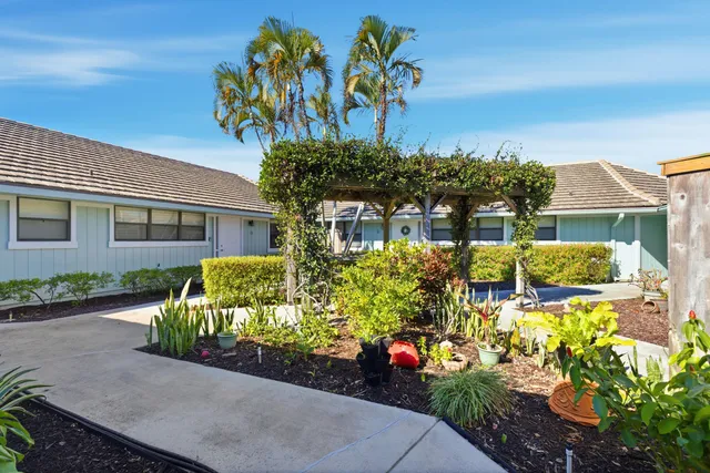 a view of a lake with a table and chairs