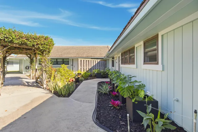 a view of a lake with houses in back