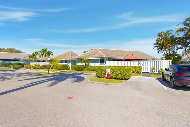 a view of swimming pool with outdoor seating and city view