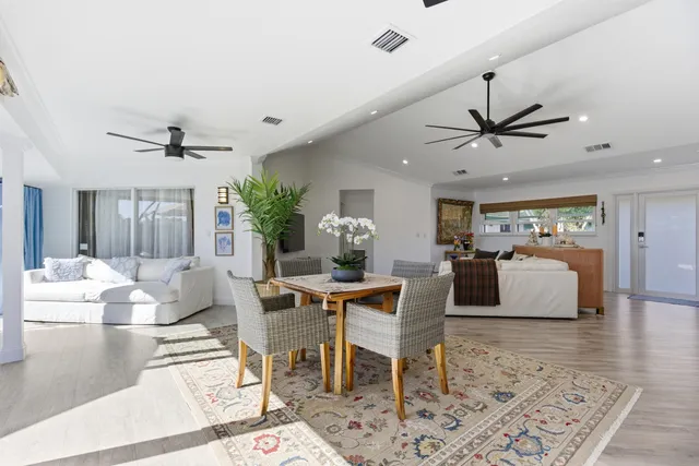 a kitchen with granite countertop a sink stainless steel appliances and counter space