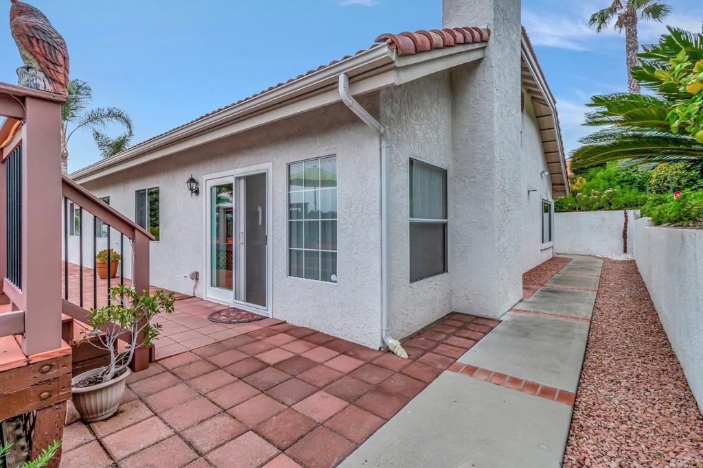 1205 Rancho Pacifica Place Vista, CA 92084 - Photo 25 of 42 a backyard of a house with potted plants