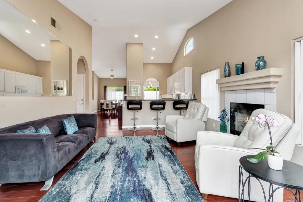 1205 Rancho Pacifica Place Vista, CA 92084 - Photo 29 of 42 a living room with furniture and a fireplace