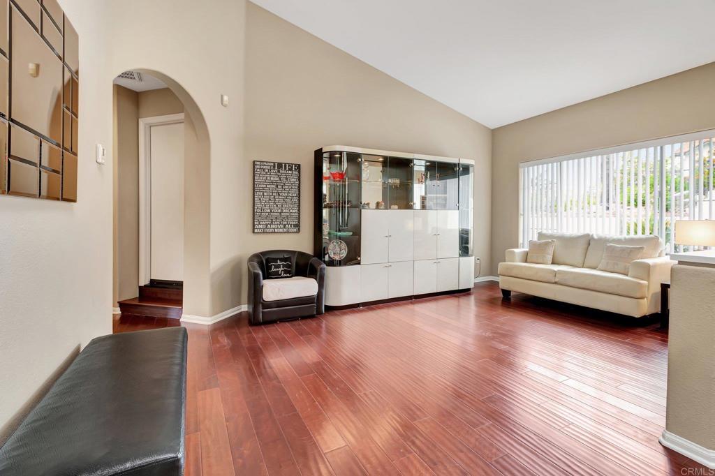 1205 Rancho Pacifica Place Vista, CA 92084 - Photo 31 of 42 a living room with furniture and a wooden floor