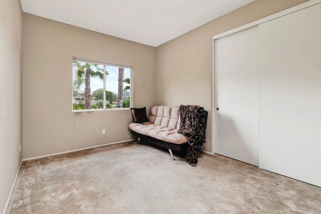 1205 Rancho Pacifica Place Vista, CA 92084 - Photo 37 of 42 a living room with furniture and a window