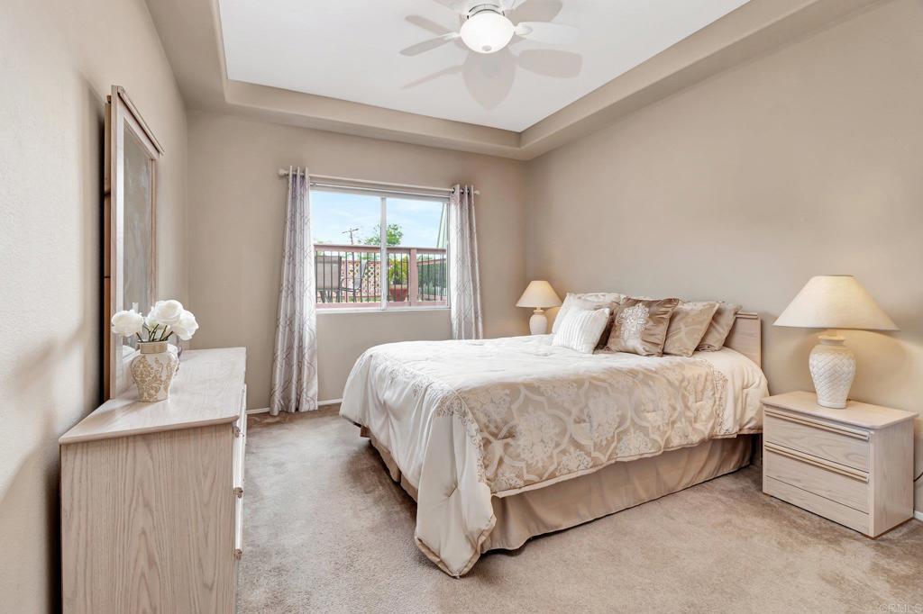 1205 Rancho Pacifica Place Vista, CA 92084 - Photo 40 of 42 a spacious bedroom with a bed and a window