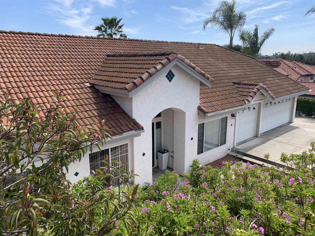 1205 Rancho Pacifica Place Vista, CA 92084 - Photo 4 of 42 front view of a house with a yard