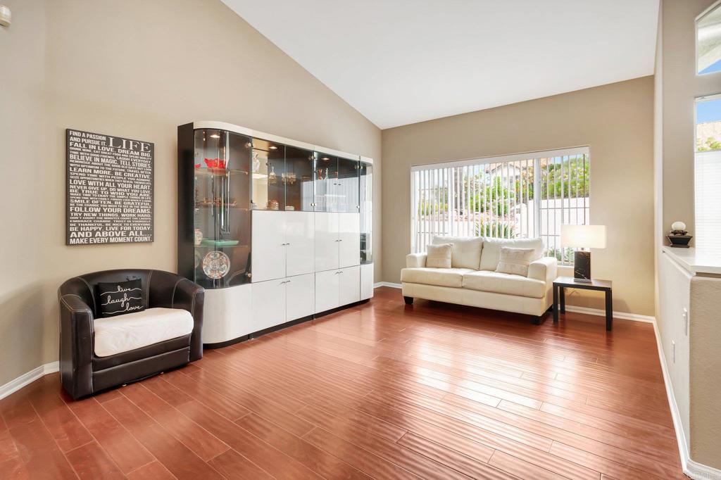 1205 Rancho Pacifica Place Vista, CA 92084 - Photo 8 of 42 a living room with furniture and a couch