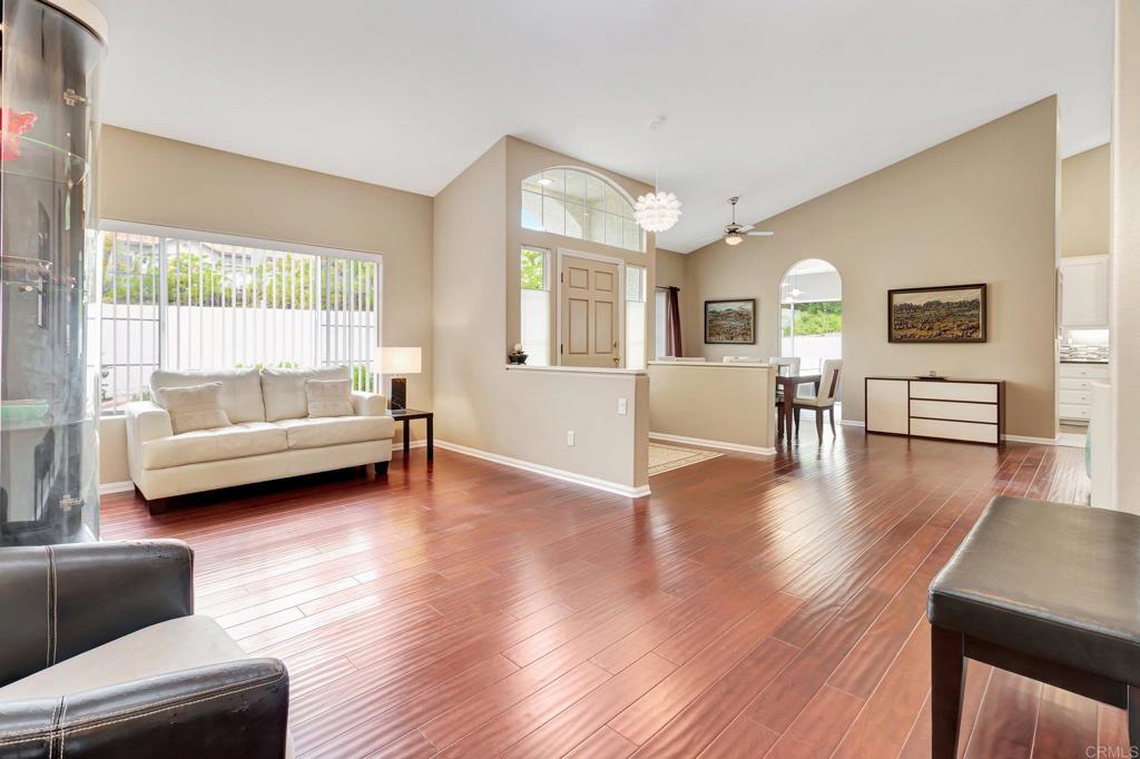 1205 Rancho Pacifica Place Vista, CA 92084 - Photo 9 of 42 a living room with furniture and a wooden floor