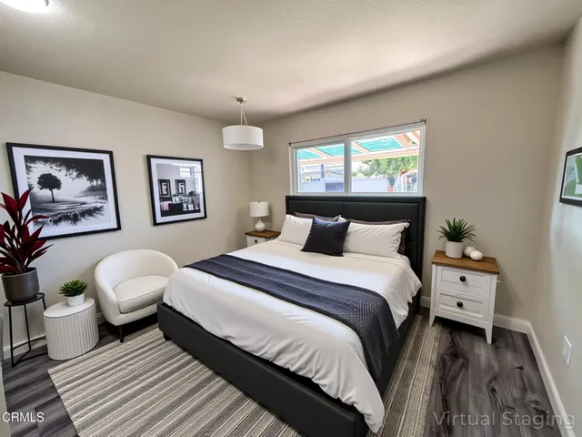 a bedroom with bed and a window