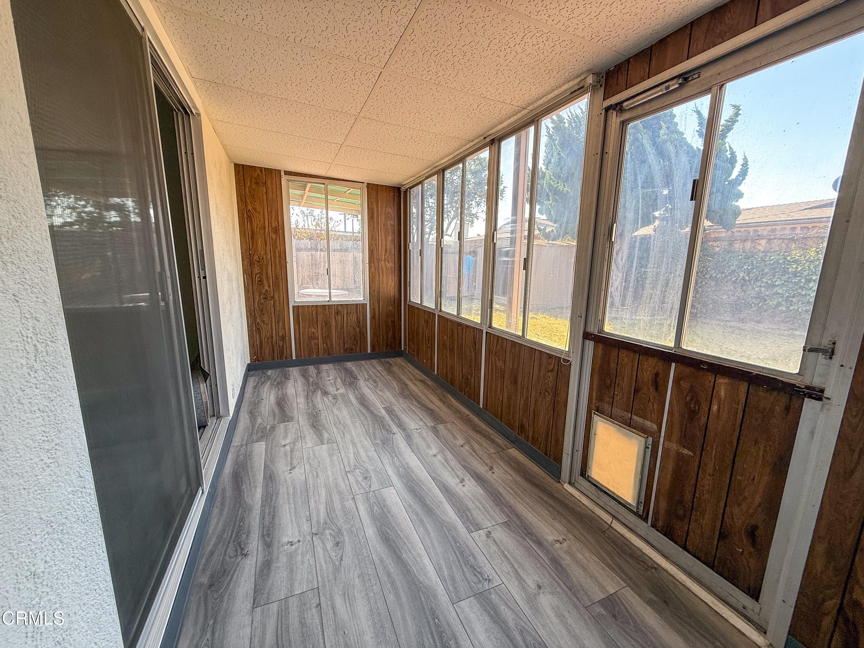 1730 West Hemlock Street Oxnard, CA 93035 - Photo 21 of 25 a view of a room with wooden floor and staircase
