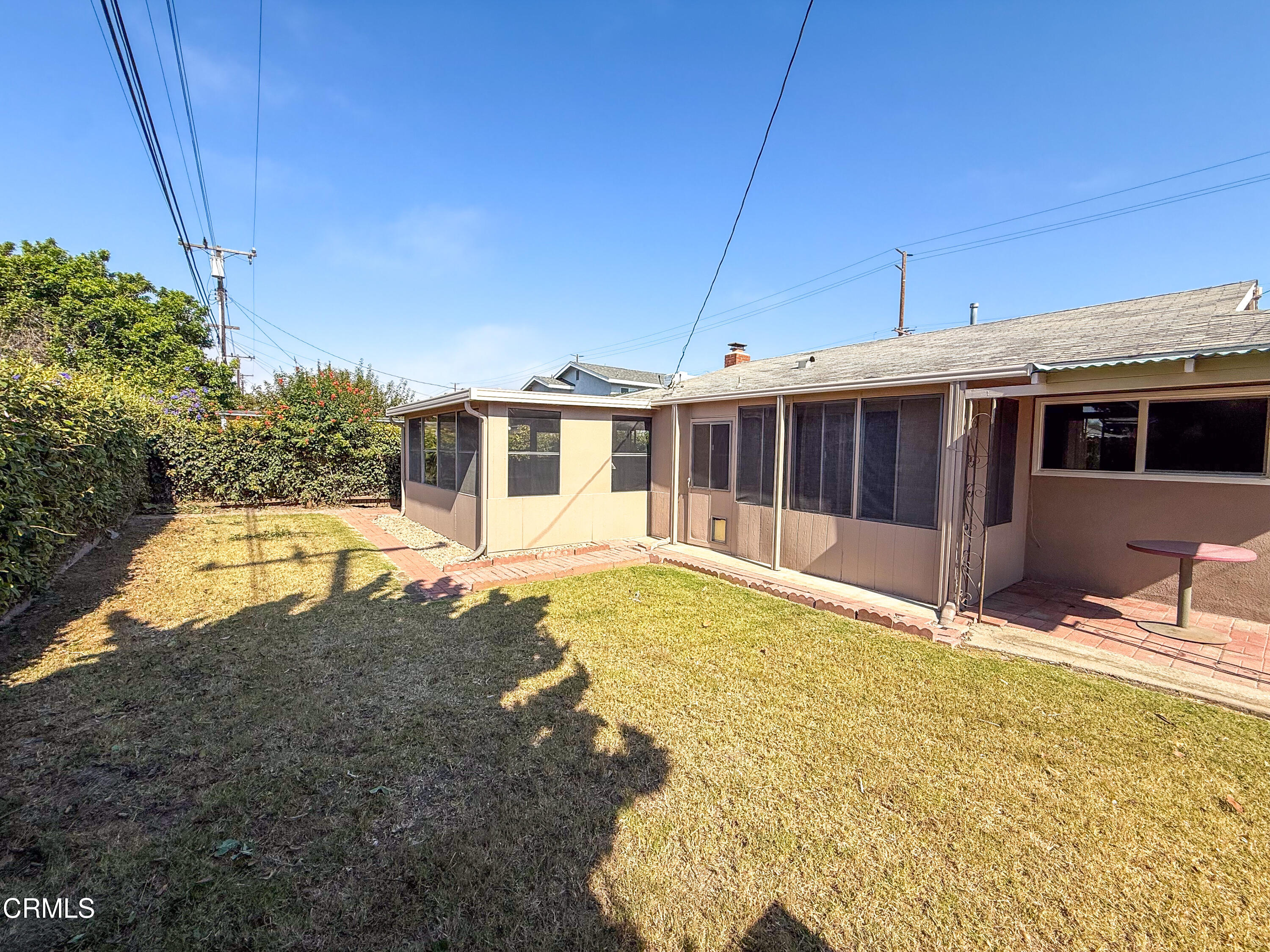 1730 West Hemlock Street Oxnard, CA 93035 - Photo 23 of 25 a view of a house with a swimming pool