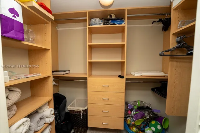 a bathroom with a sink mirror toilet and shower