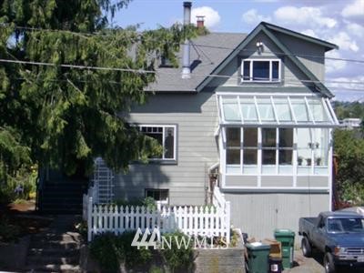 716 North 63rd Street Seattle, WA 98103 - Photo 1 of 1 a front view of a house with a yard