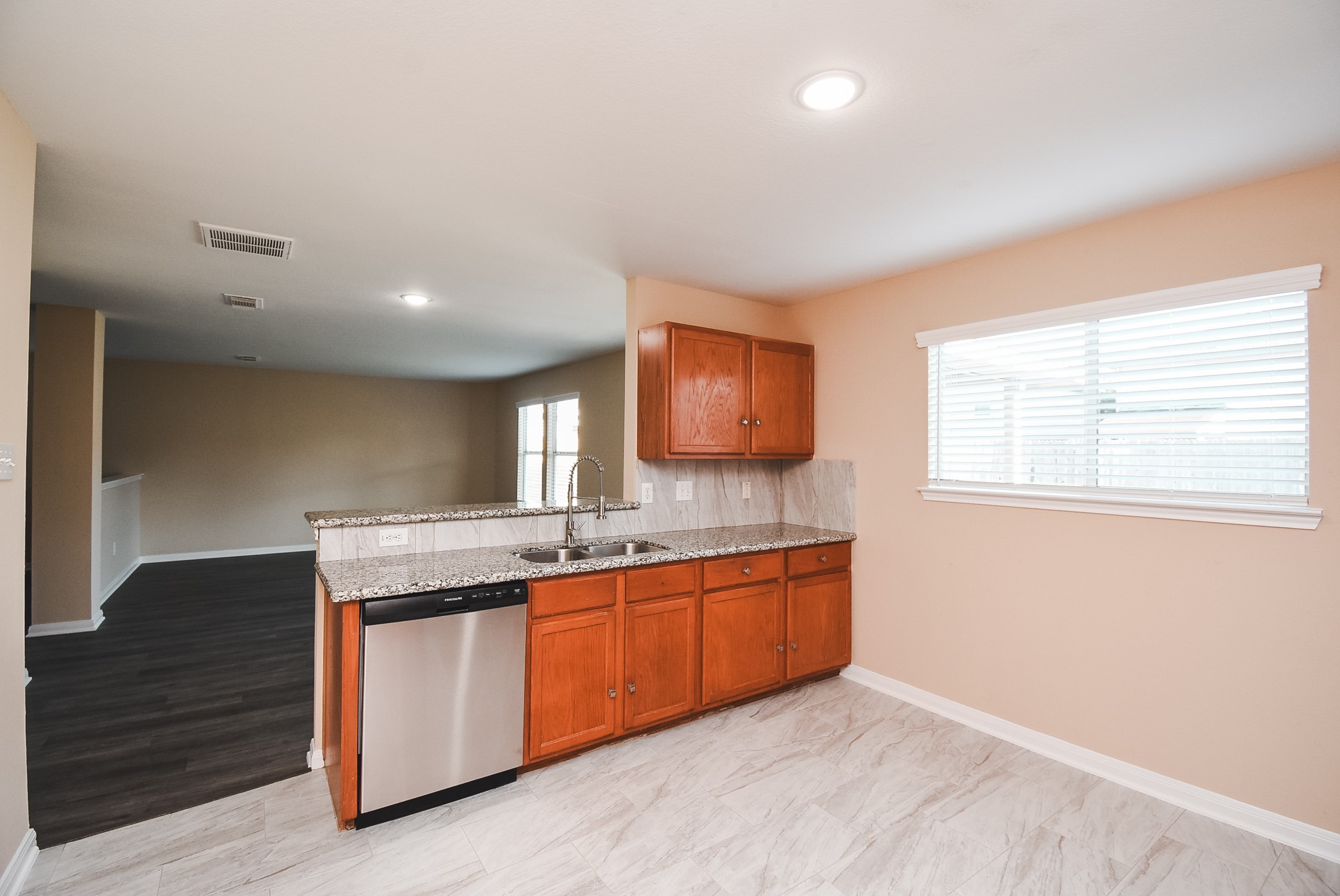 20815 Baronsledge Lane Katy, TX 77449 - Photo 13 of 31 a kitchen with granite countertop a sink and a stove top oven